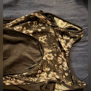 Floral Patterned and black ladies leotard with bam cut out